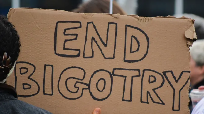 end bigotry sign